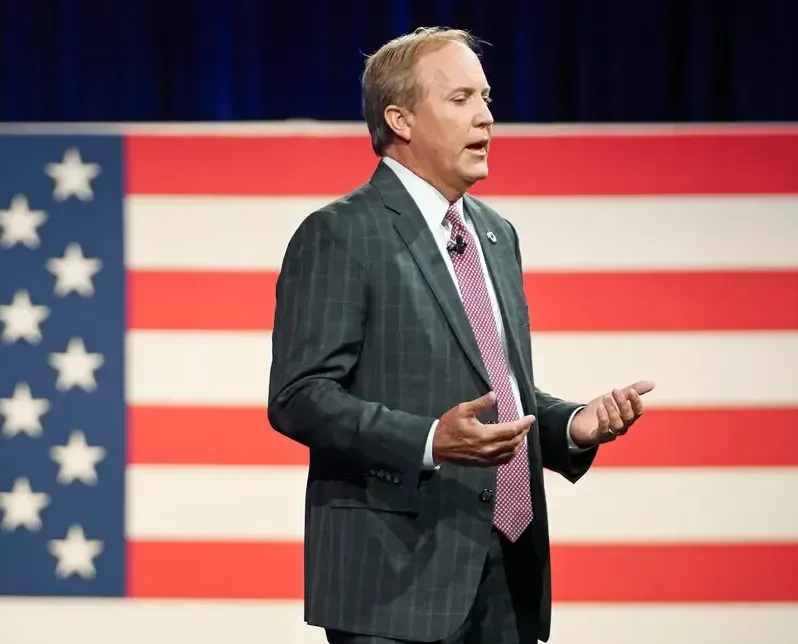 Ken Paxton with flag